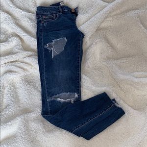 distressed garage skinny jeans
